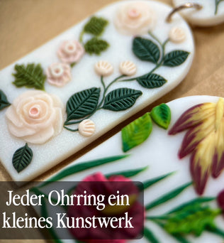 Handgemachte Ohrringe von Fleurissima Bijou aus Polymer Clay mit floralen Designs und rostfreiem Edelstahl. Einzigartige Unikate für sensible Ohren.